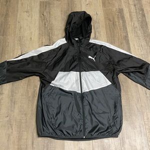 Black, white, and dark grey puma windbreaker